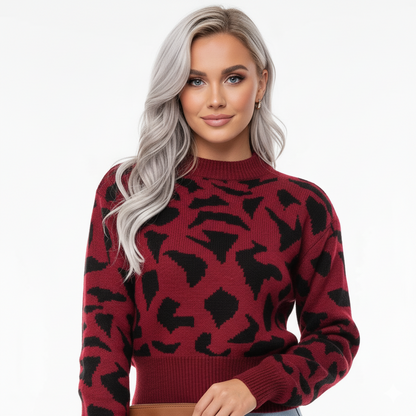 Close-up breisel en print detail trui luipaardprint rood – ronde hals